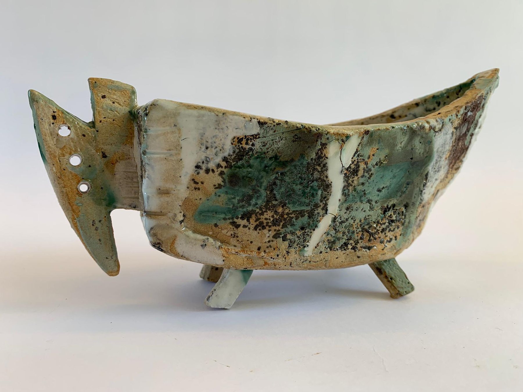 Boat-like footed ceramic vessel with moss glaze by Graham Matthews
